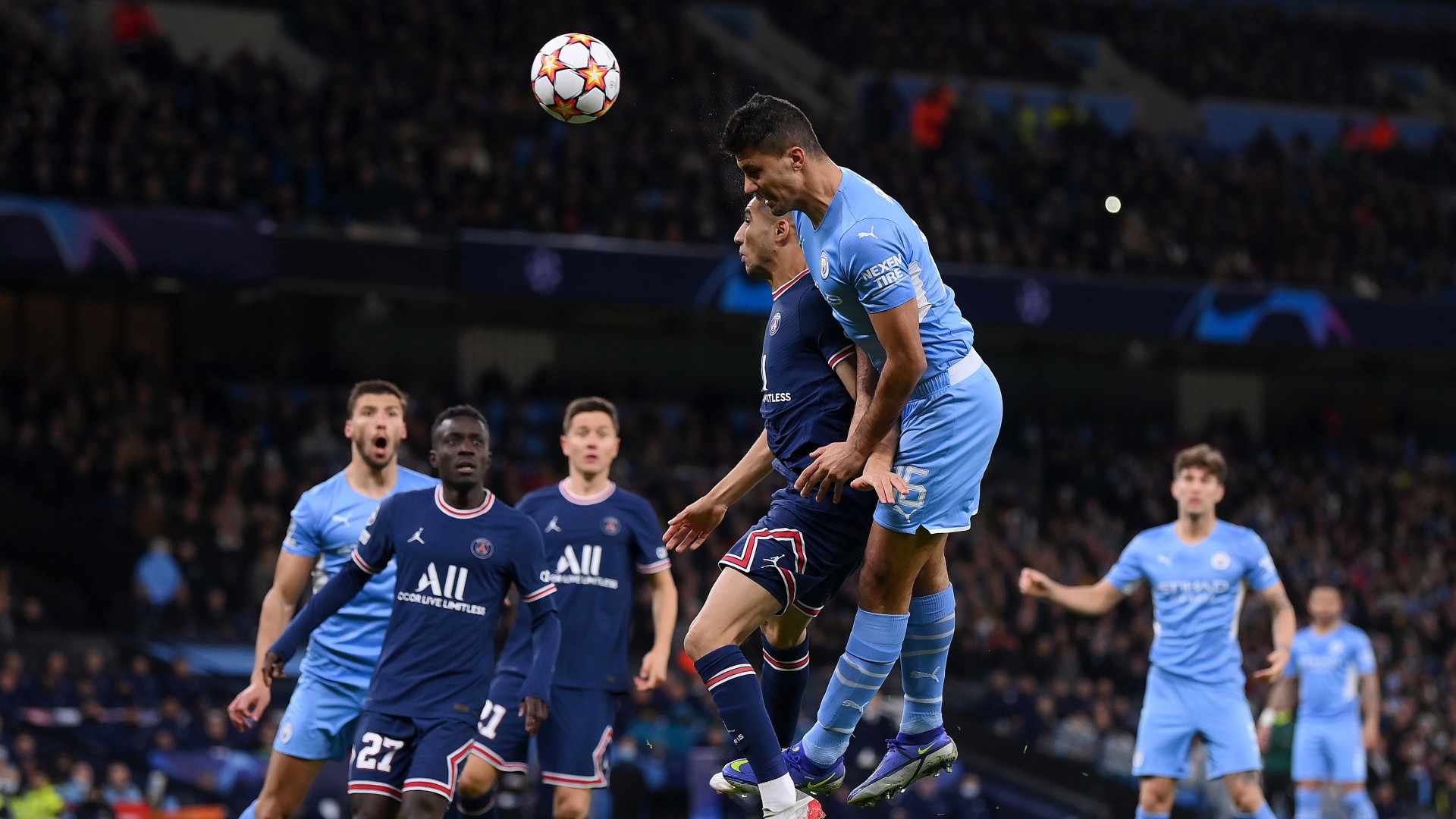 Manchester City and PSG contest a header in an archive photograph from 2021